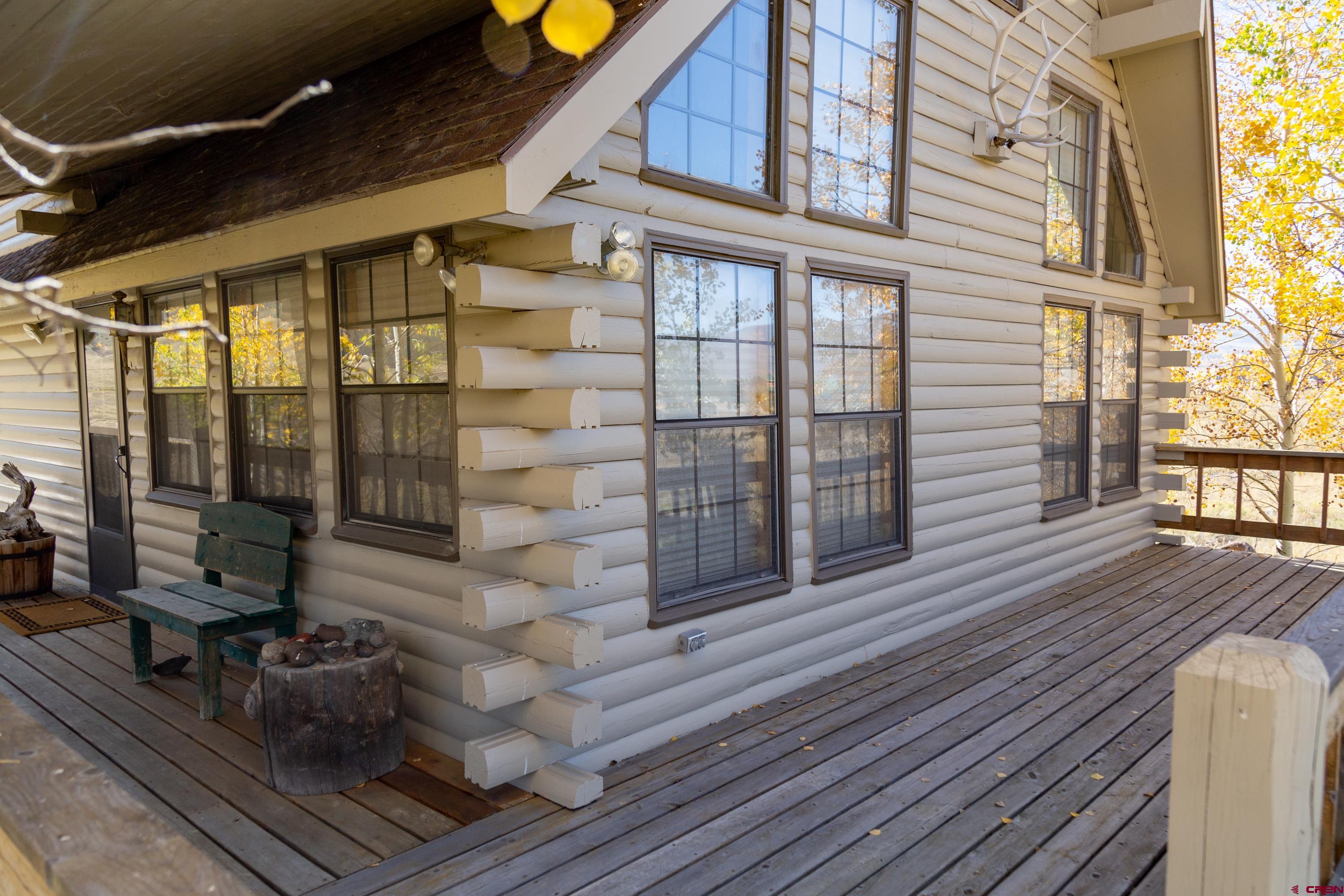 516 Rio Grande Court Creede, CO 81130 - Photo 23 of 33 a room with wooden floor and furniture