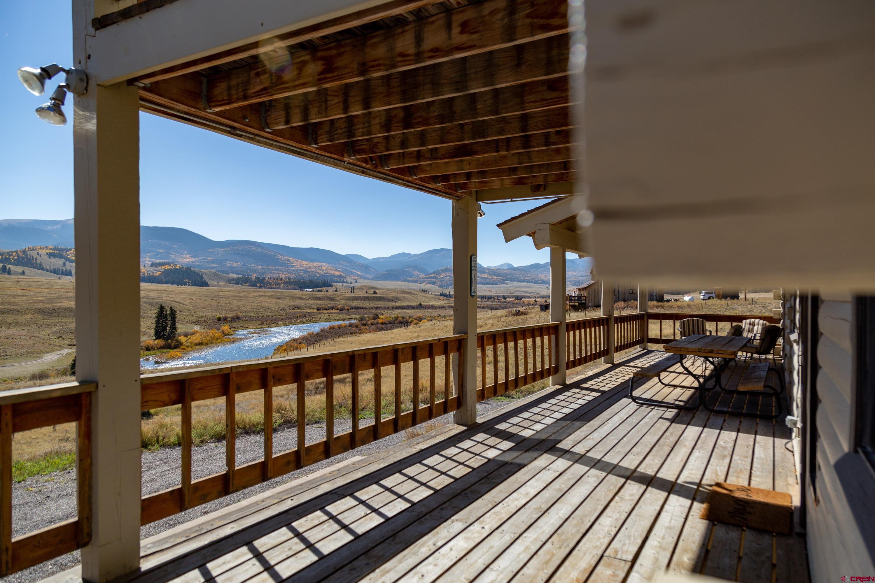 516 Rio Grande Court Creede, CO 81130 - Photo 24 of 33 a view of a balcony with wooden floor