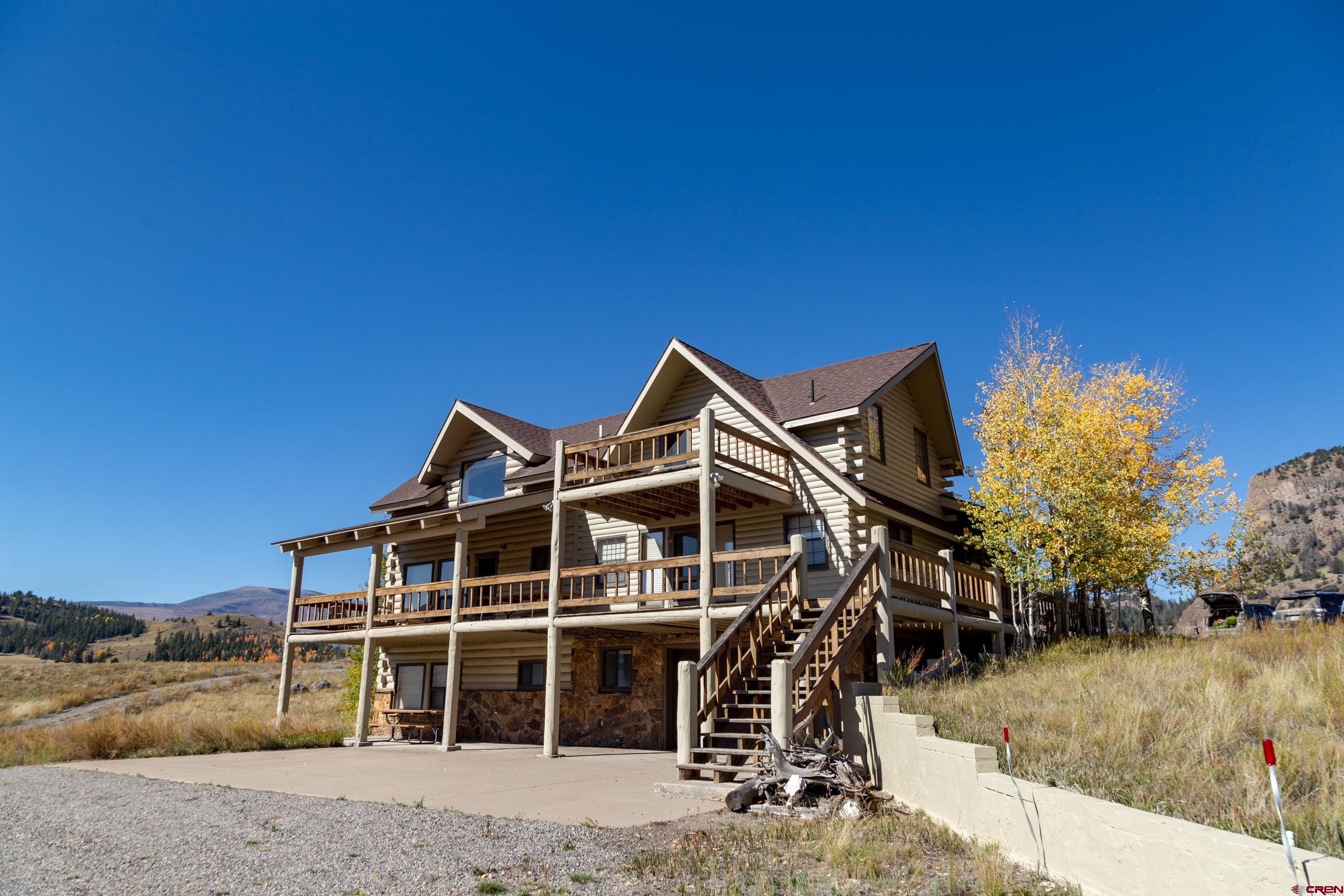 516 Rio Grande Court Creede, CO 81130 - Photo 29 of 33 a house with trees in front of it