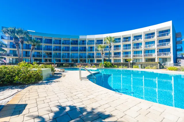 a view of a swimming pool with a lounge chair