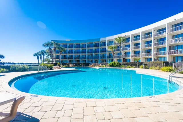 a view of swimming pool with outdoor seating