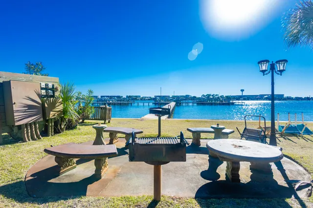 a swimming pool with outdoor seating and yard