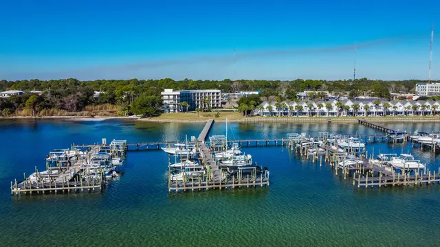 a view of a lake with boats and trees in the background