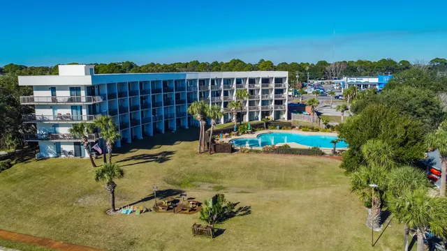 a view of a swimming pool with a lounge chair