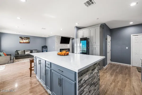 a bathroom with a sink mirror and toilet