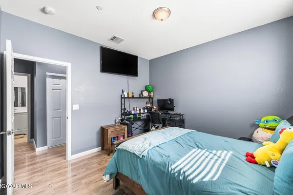 a view of a house with backyard sitting area and garden