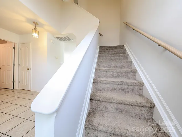 a view of staircase with white walls and white walls