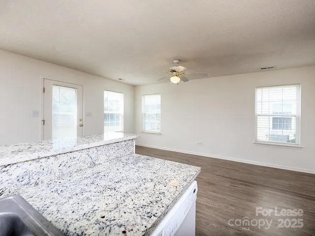 an empty room with wooden floor