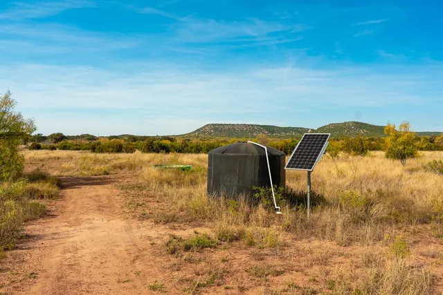 a view of a chairs and table in the patio