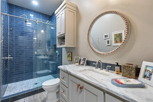 a bed room with a bed and a ceiling fan