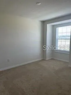 a view of barbeque grill with wooden floor