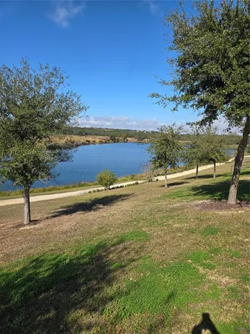 an outdoor sitting area with lake view and mountain view