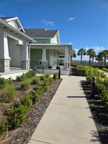 a view of a swimming pool with lounge chairs