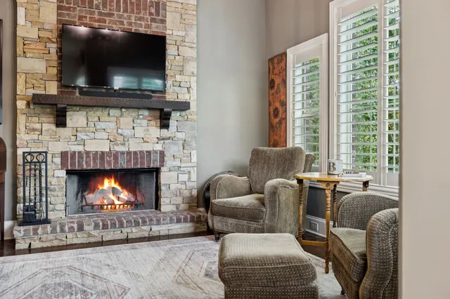 a bathroom with a granite countertop sink a toilet and a mirror