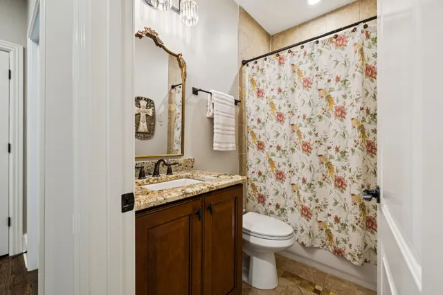 a living room with furniture ceiling fan and a rug