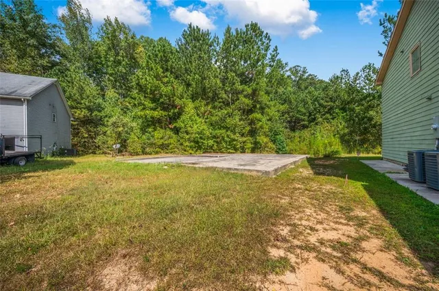 a view of yard and swimming pool