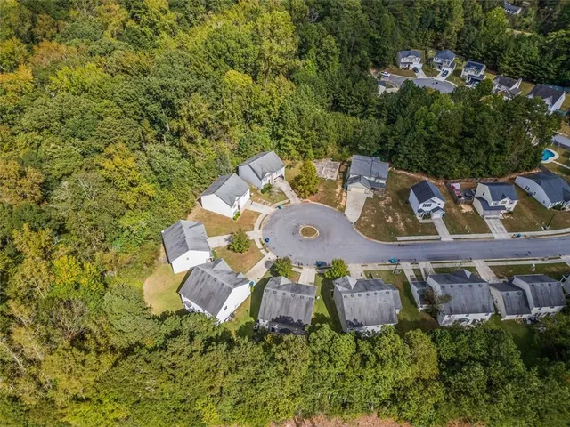 an aerial view of a house with outdoor space