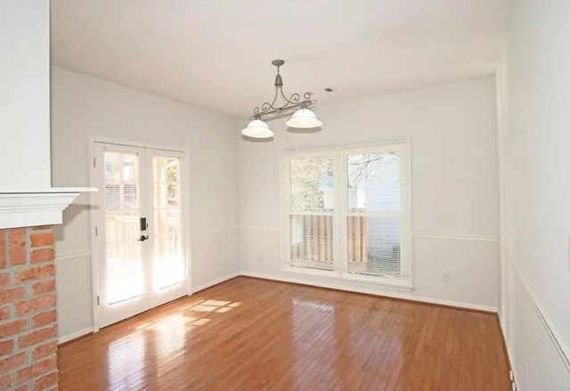 a kitchen with granite countertop a sink stove and refrigerator