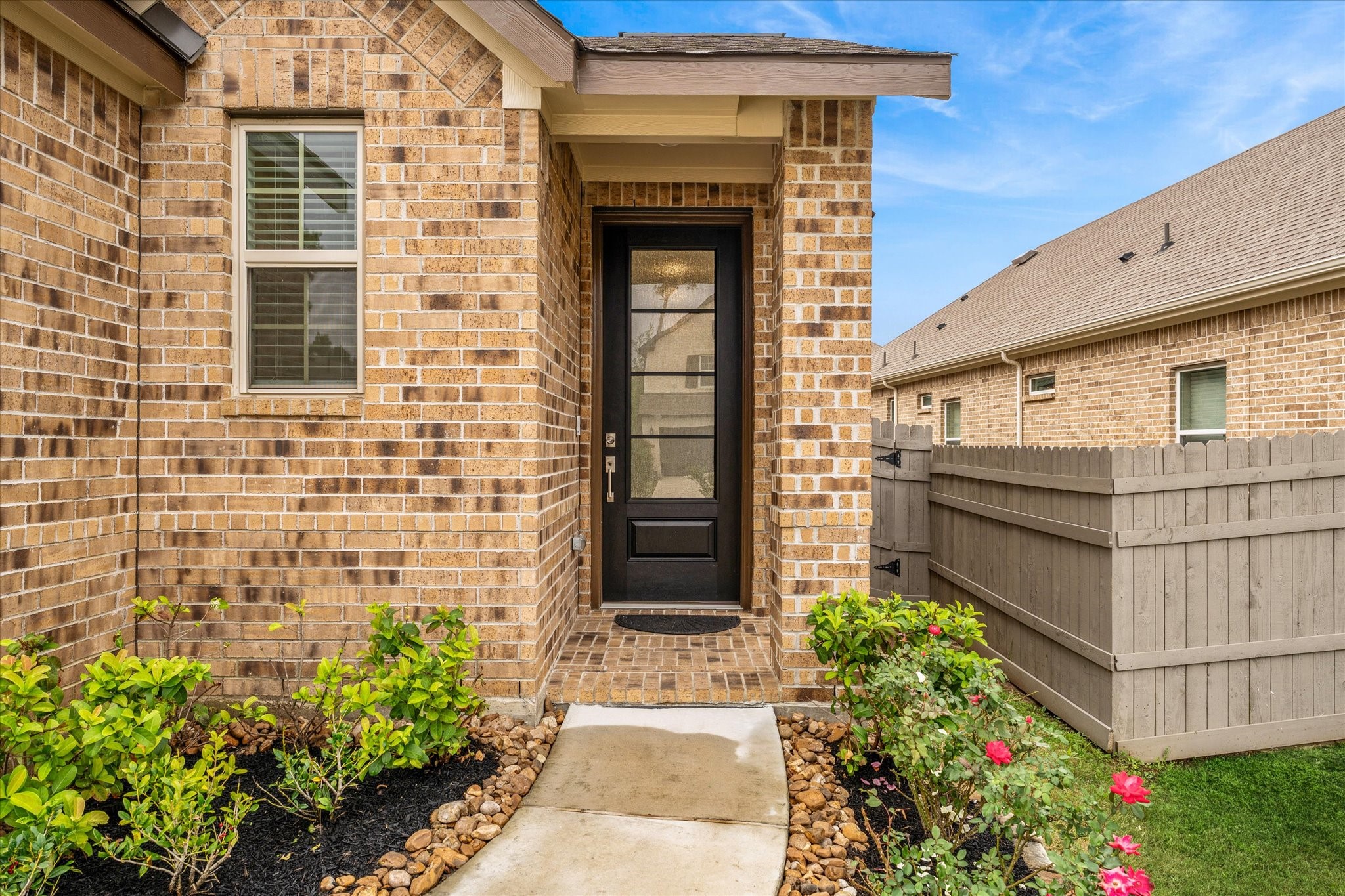 15520 Sunset Maple Court Conroe, TX 77302 - Photo 3 of 46 a front view of a house with a garden