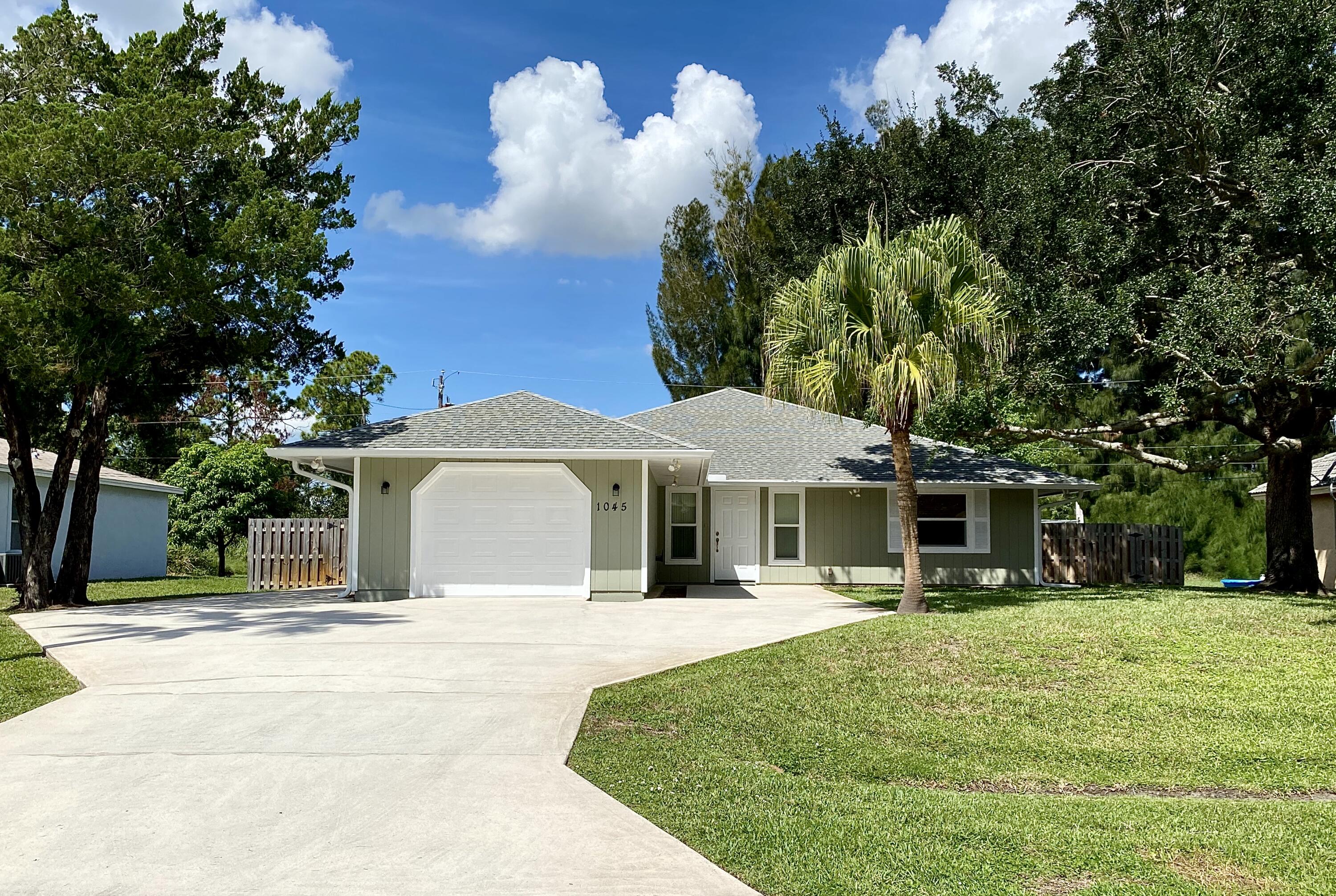 1045 Southwest Bay State Road Port St. Lucie, FL 34953 - Photo 3 of 62 55D4C04F-944F-4AD9-BA16-4169C2A44F7E