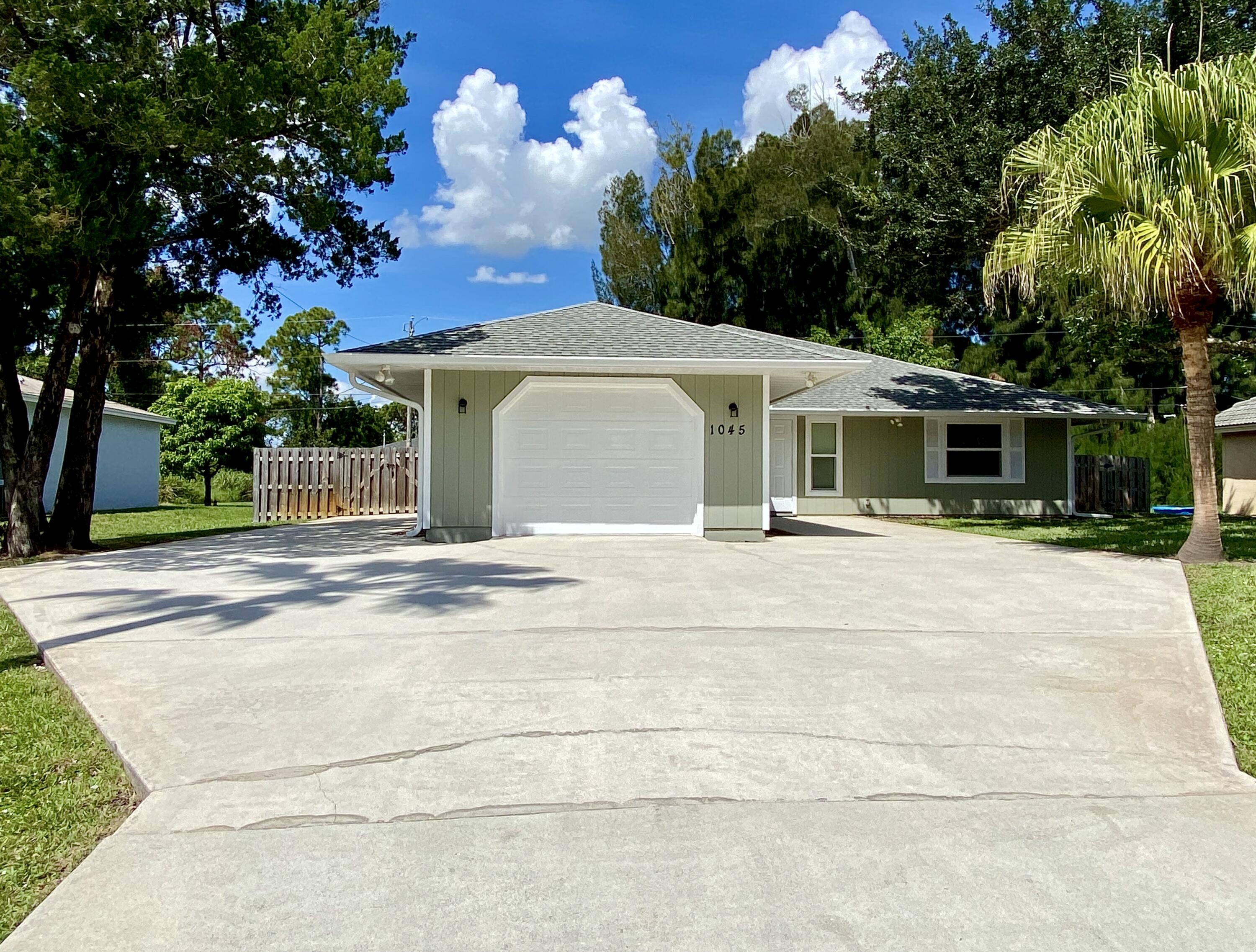 1045 Southwest Bay State Road Port St. Lucie, FL 34953 - Photo 7 of 62 62D44C54-754B-40AD-8319-3B63E901D15D