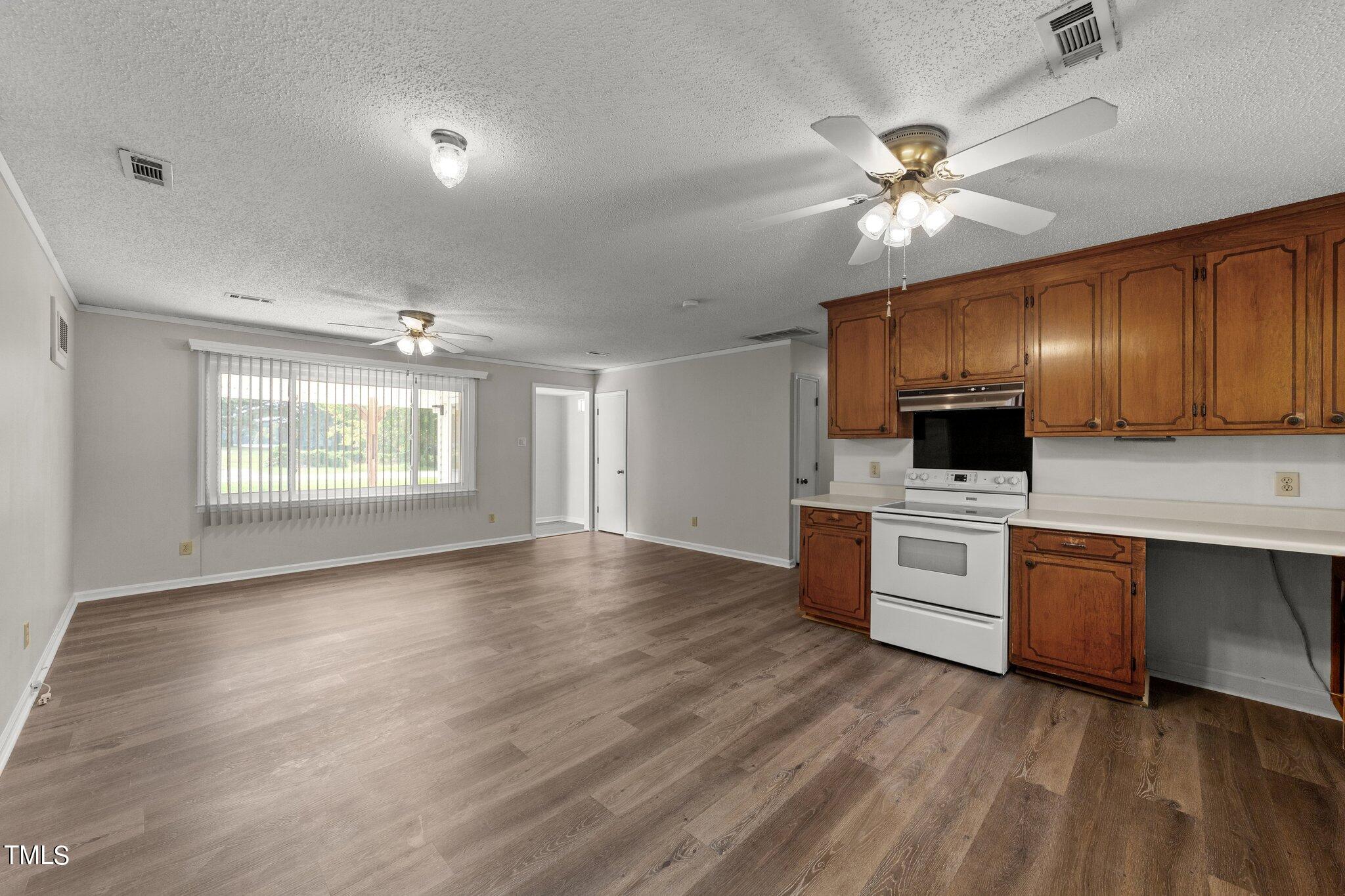 4868 Buffalo Road Selma, NC 27576 - Photo 13 of 48 a view of kitchen with sink microwave and cabinets