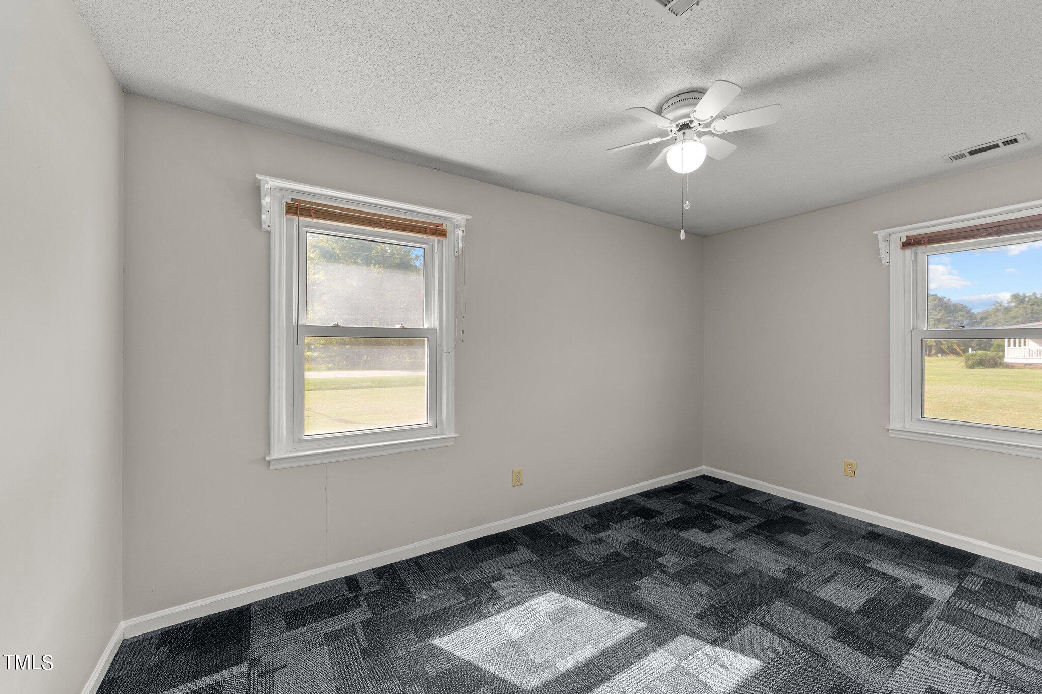 4868 Buffalo Road Selma, NC 27576 - Photo 18 of 48 a view of a livingroom with a window