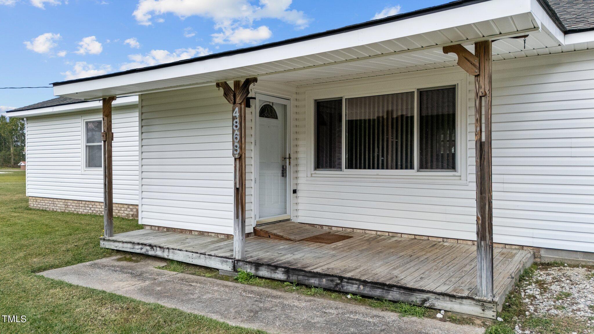 4868 Buffalo Road Selma, NC 27576 - Photo 2 of 48 a view of a house with a yard