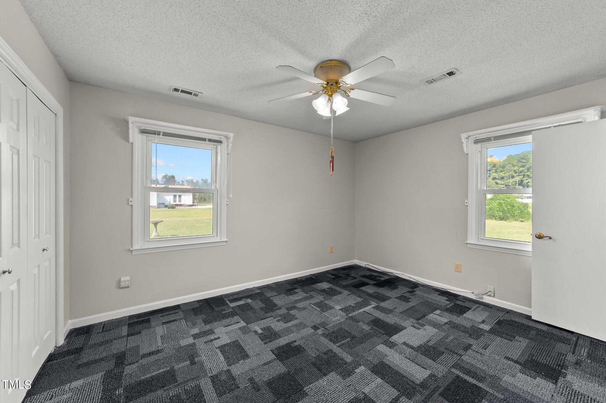 4868 Buffalo Road Selma, NC 27576 - Photo 24 of 48 a view of an empty room with a window