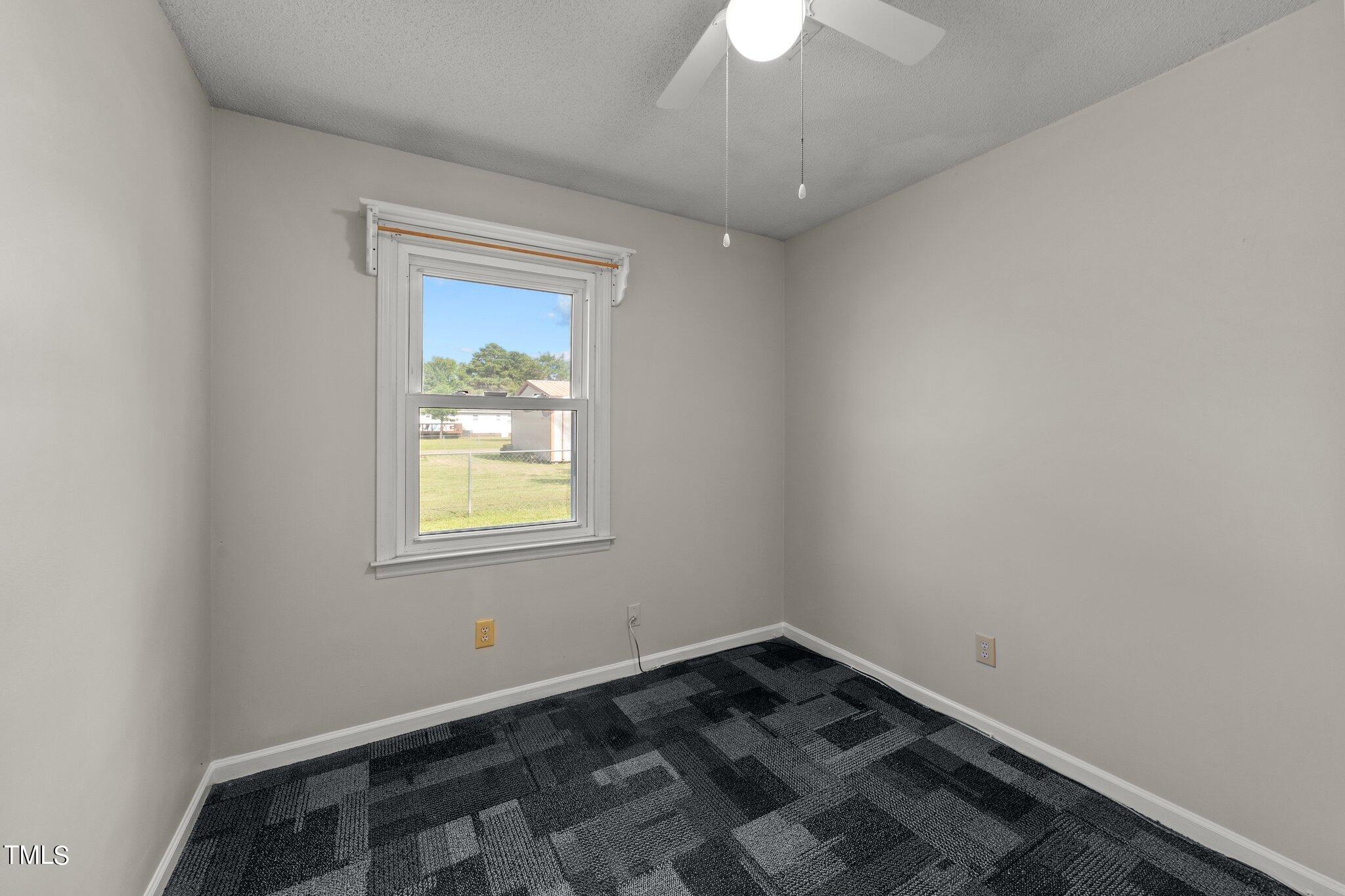 4868 Buffalo Road Selma, NC 27576 - Photo 26 of 48 an empty room with a window