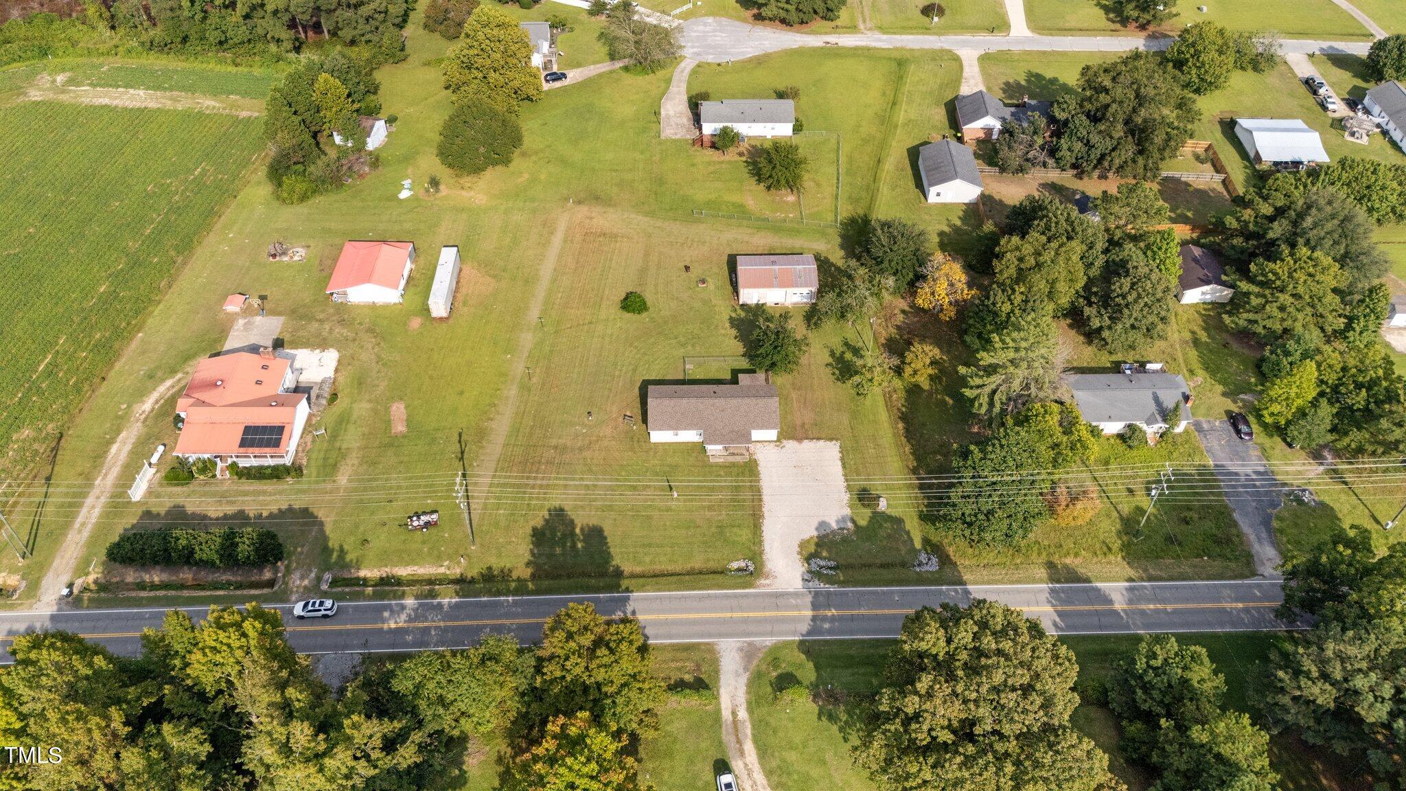 4868 Buffalo Road Selma, NC 27576 - Photo 33 of 48 an aerial view of residential houses with outdoor space