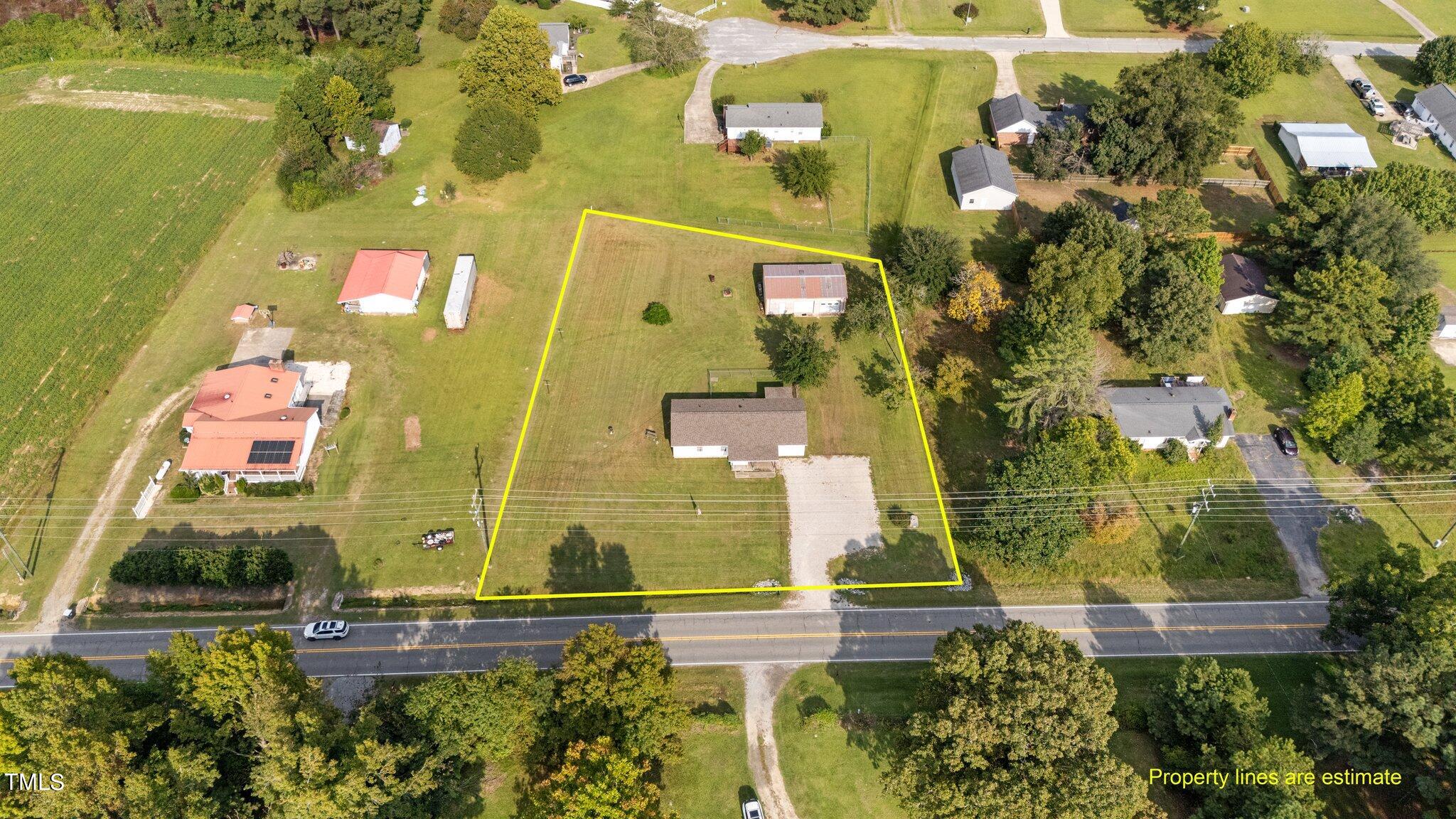 4868 Buffalo Road Selma, NC 27576 - Photo 34 of 48 an aerial view of residential houses with outdoor space