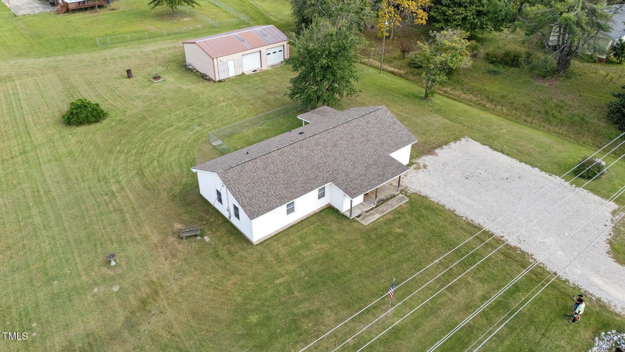 4868 Buffalo Road Selma, NC 27576 - Photo 39 of 48 a view of a house with a yard