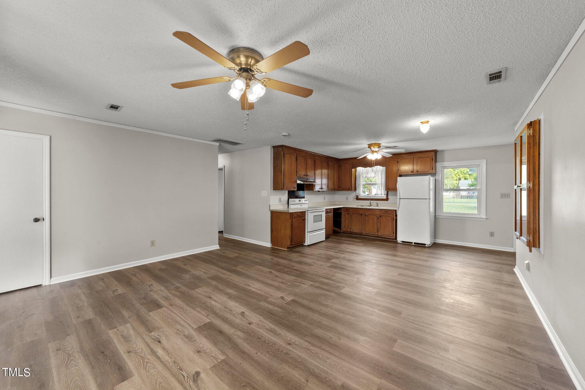 4868 Buffalo Road Selma, NC 27576 - Photo 6 of 48 a view of a kitchen with a sink and a window