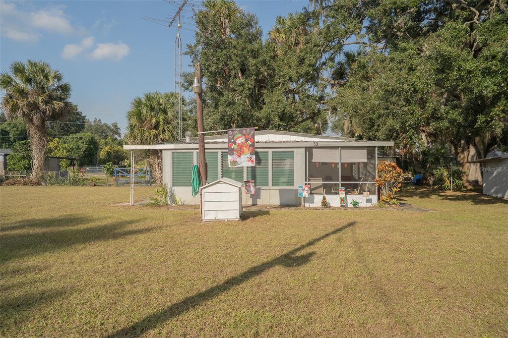 28 Basin Street Lorida, FL 33857 - Photo 1 of 28 a view of a house with backyard and sitting area