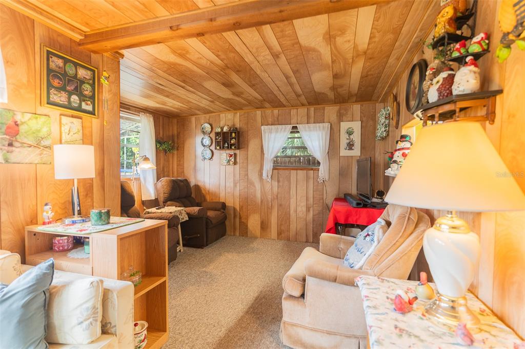 28 Basin Street Lorida, FL 33857 - Photo 3 of 28 a living room with furniture and a chandelier