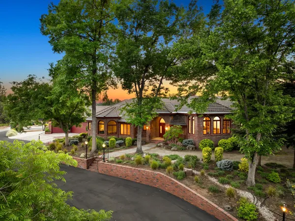 a front view of a house with garden