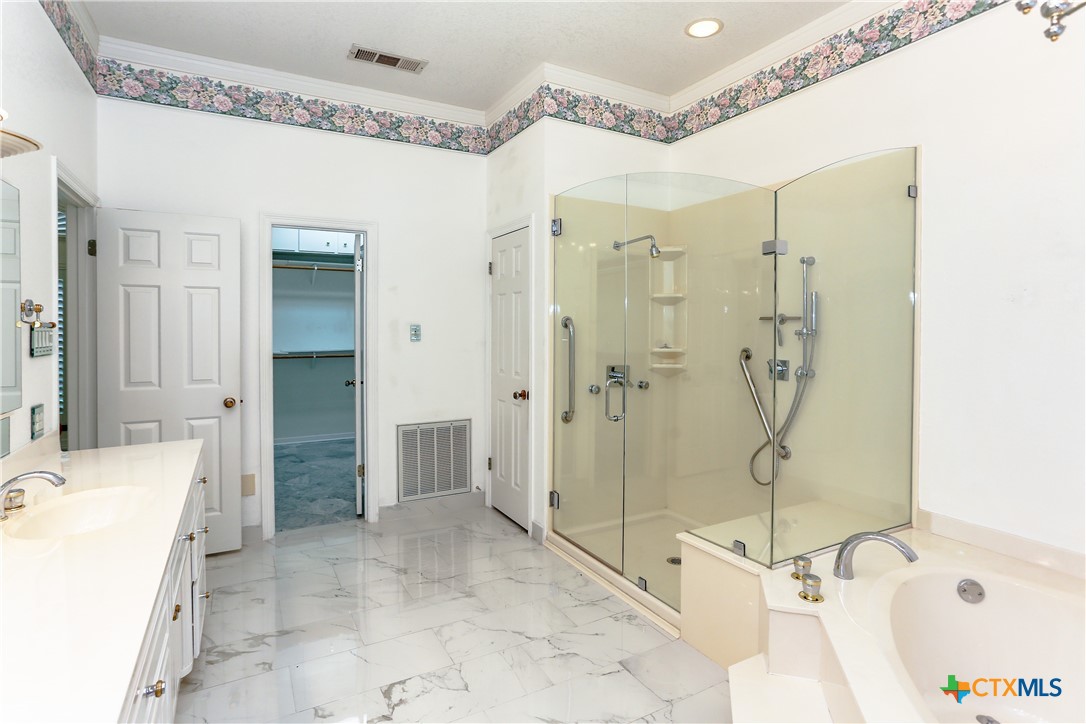 2110 Lakeview Loop Killeen, TX 76543 - Photo 17 of 42 a bathroom with a tub sink shower and a mirror