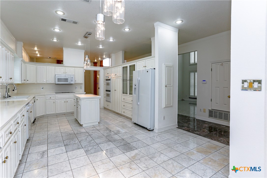 2110 Lakeview Loop Killeen, TX 76543 - Photo 22 of 42 a large kitchen with a large window and stainless steel appliances
