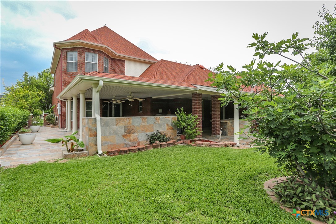 2110 Lakeview Loop Killeen, TX 76543 - Photo 40 of 42 a view of a yard in front of a house with plants and large tree