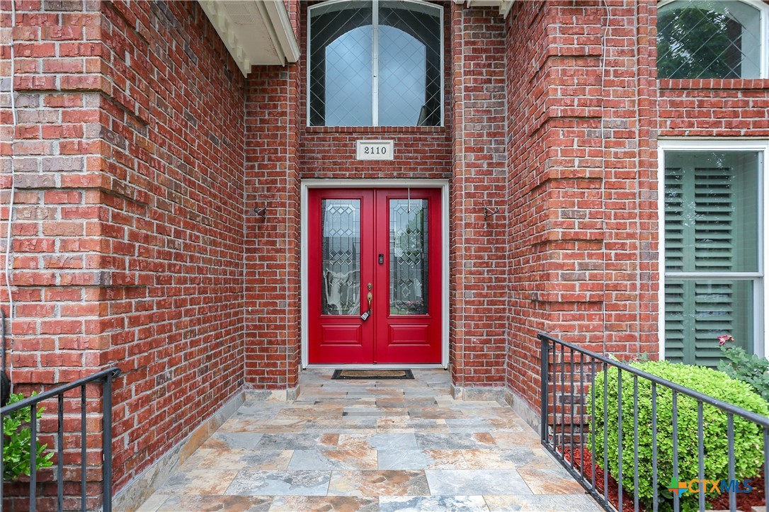 2110 Lakeview Loop Killeen, TX 76543 - Photo 5 of 42 a view of a brick building with a small yard