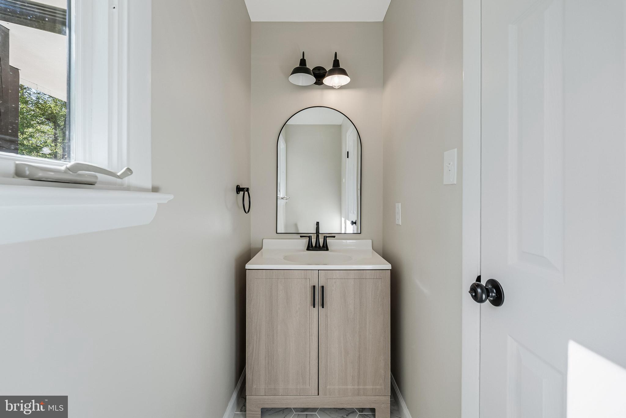 6891 Wilson Road Marshall, VA 20115 - Photo 49 of 118 Sleek modern bathroom with natural light.