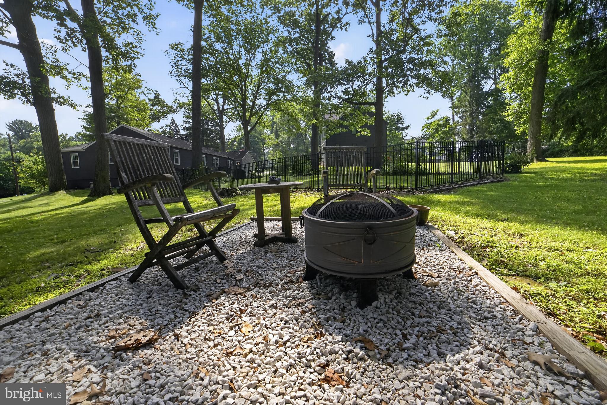 305 Irish Road Berwyn, PA 19312 - Photo 33 of 34 a view of a backyard with table and chairs couches and a fire pit