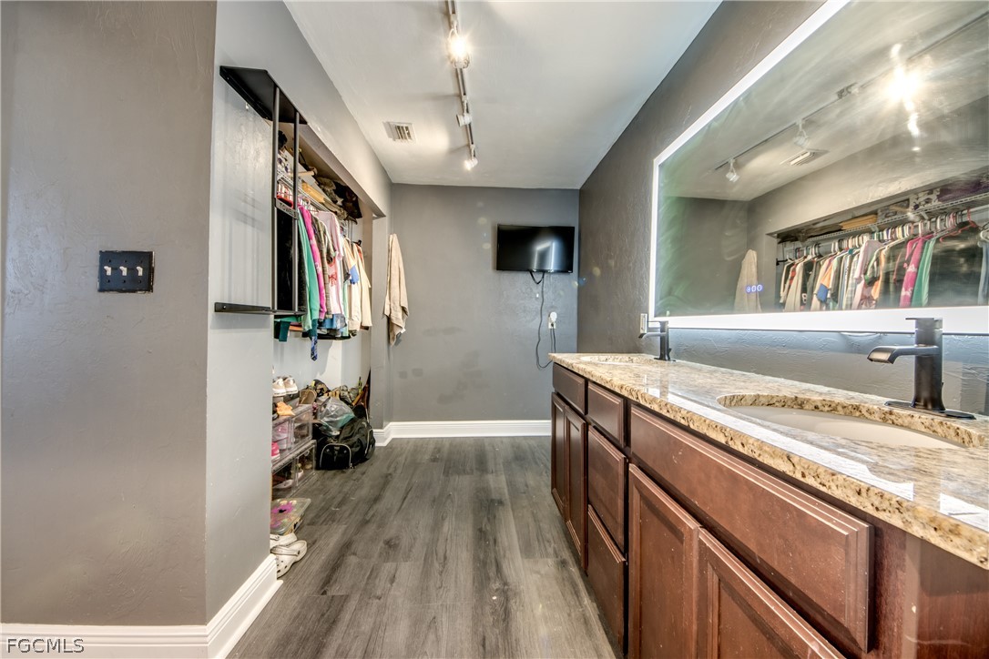 3015 8th Street Southwest Lehigh Acres, FL 33976 - Photo 17 of 34 a storage room with washer and dryer