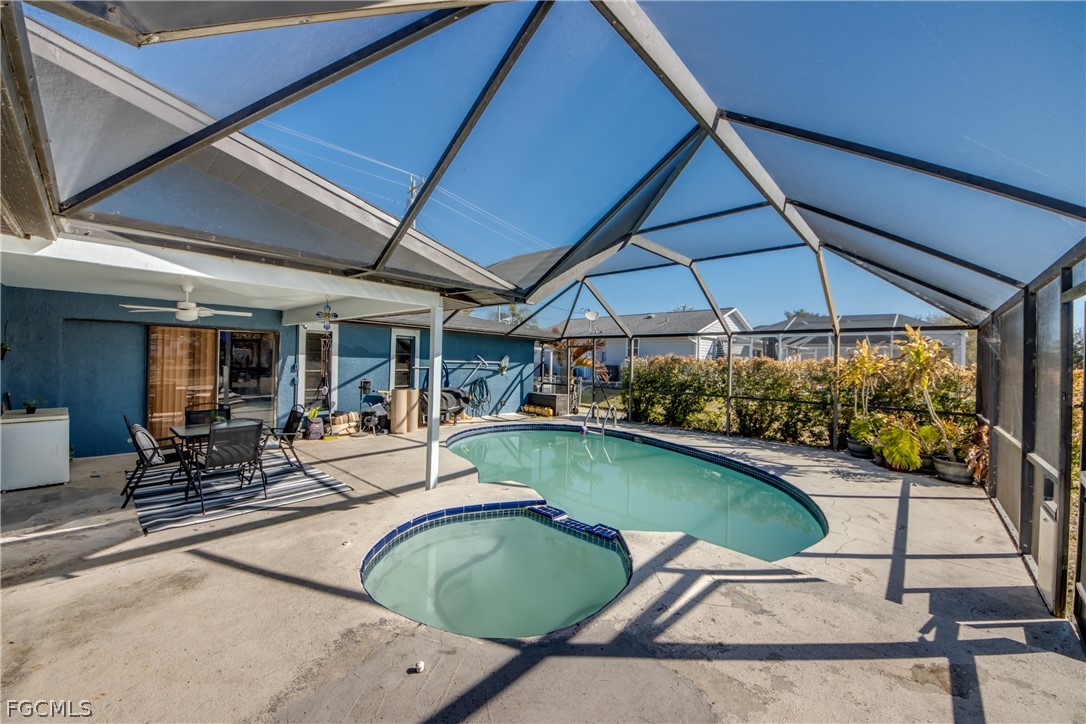 3015 8th Street Southwest Lehigh Acres, FL 33976 - Photo 28 of 34 a view of a swimming pool with a patio