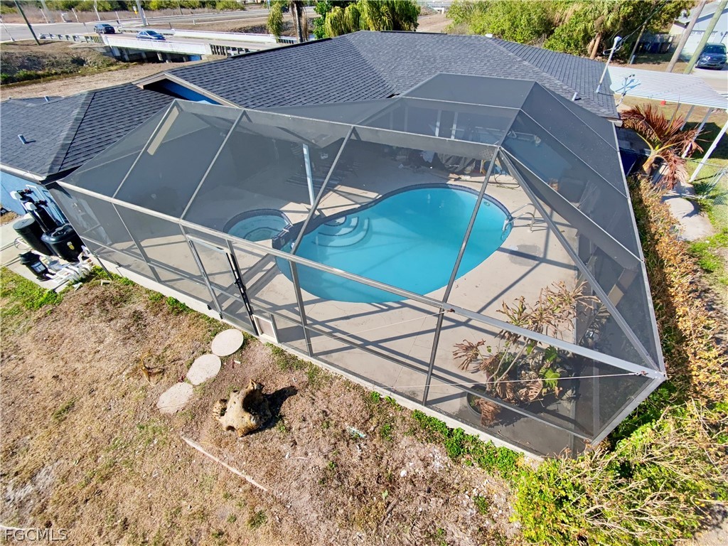 3015 8th Street Southwest Lehigh Acres, FL 33976 - Photo 29 of 34 a view of a backyard with wooden fence
