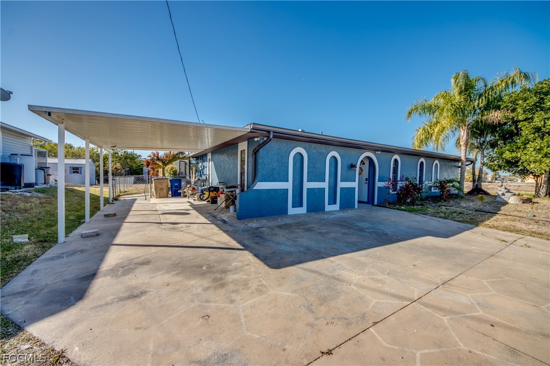 3015 8th Street Southwest Lehigh Acres, FL 33976 - Photo 3 of 34 a view of a backyard
