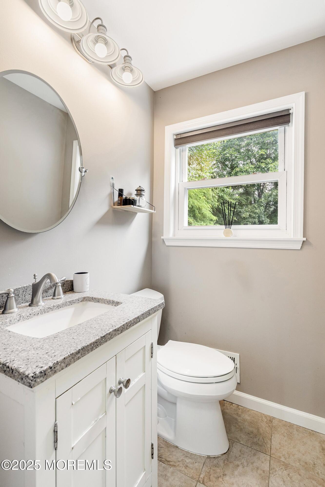 13 Rhode Island Drive Jackson, NJ 08527 - Photo 13 of 30 a bathroom with a granite countertop sink toilet and a mirror