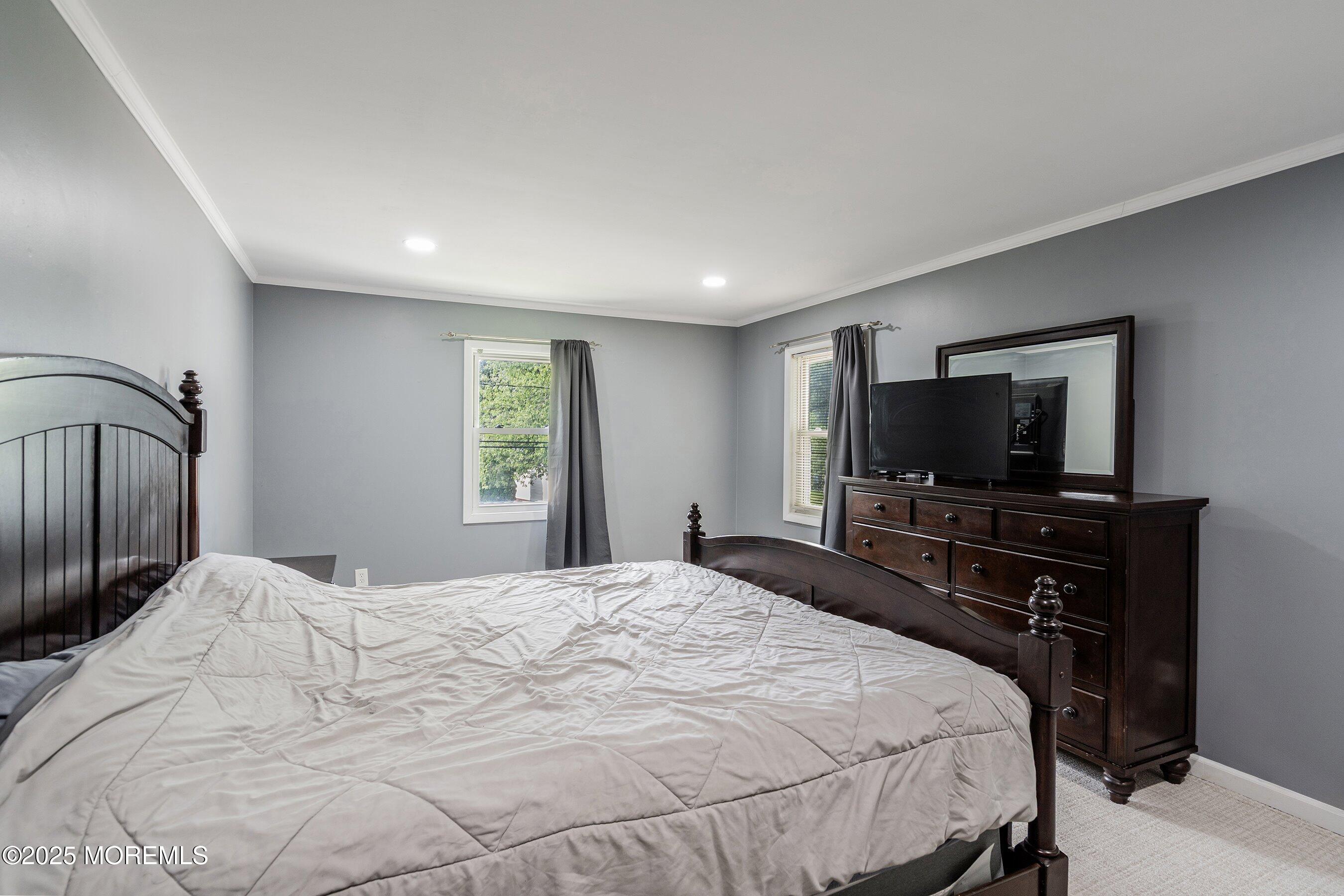 13 Rhode Island Drive Jackson, NJ 08527 - Photo 14 of 30 a bedroom with a bed and a flat screen tv