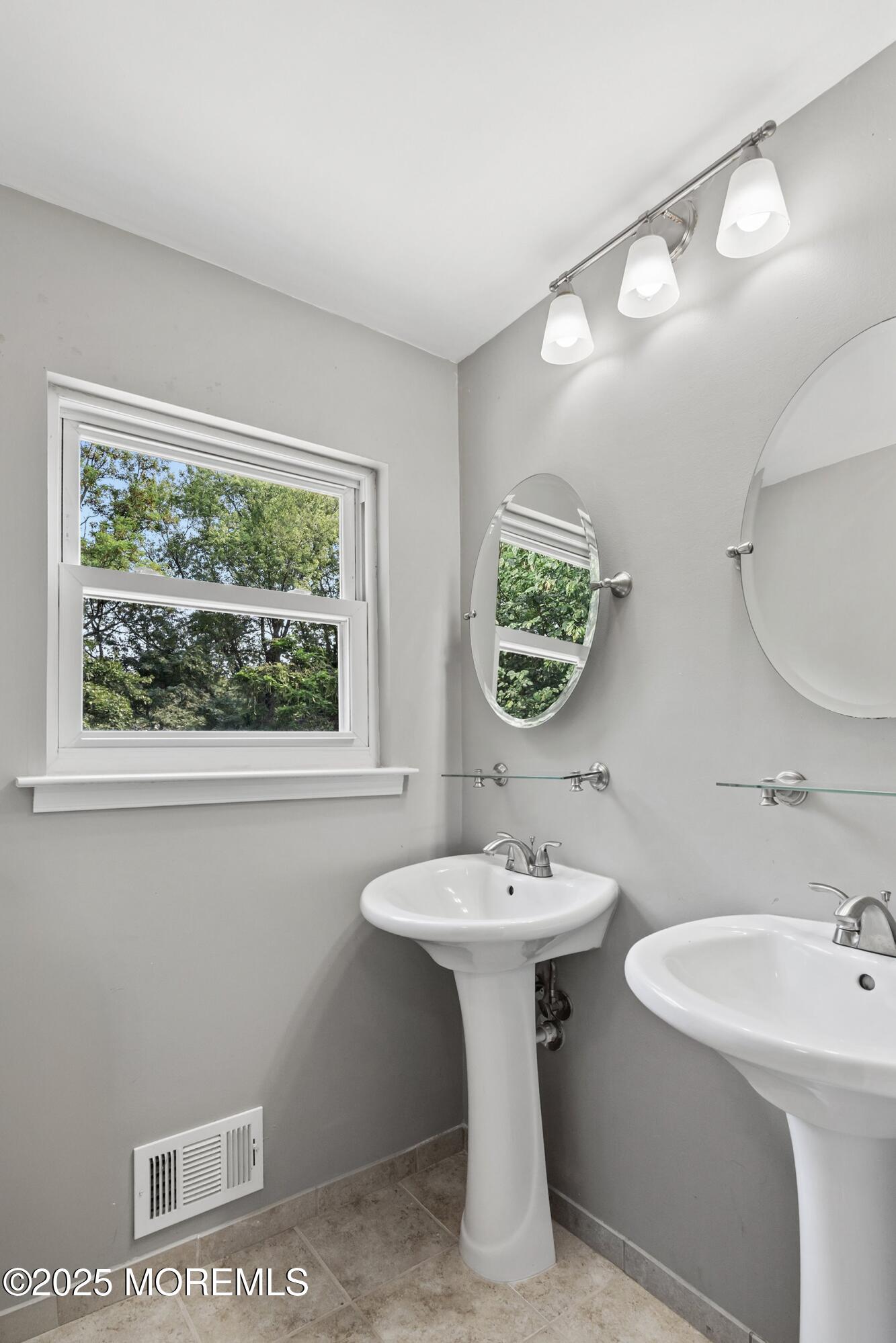 13 Rhode Island Drive Jackson, NJ 08527 - Photo 19 of 30 a bathroom with a sink and a mirror